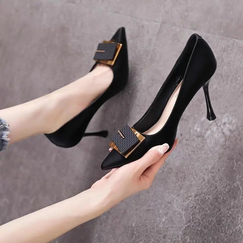Elegant Black Heels With Gold Buckle Accent